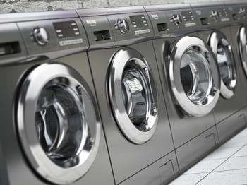 Row of Washing Machines in a Public Laundromat